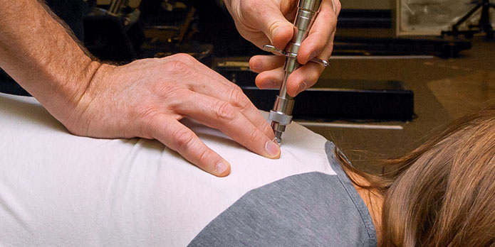 patient getting activator methods as an auto accident injury treatment in Southeast Florida