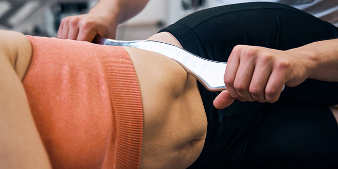 patient getting graston chiropractic as an auto accident injury treatment in Southeast Florida